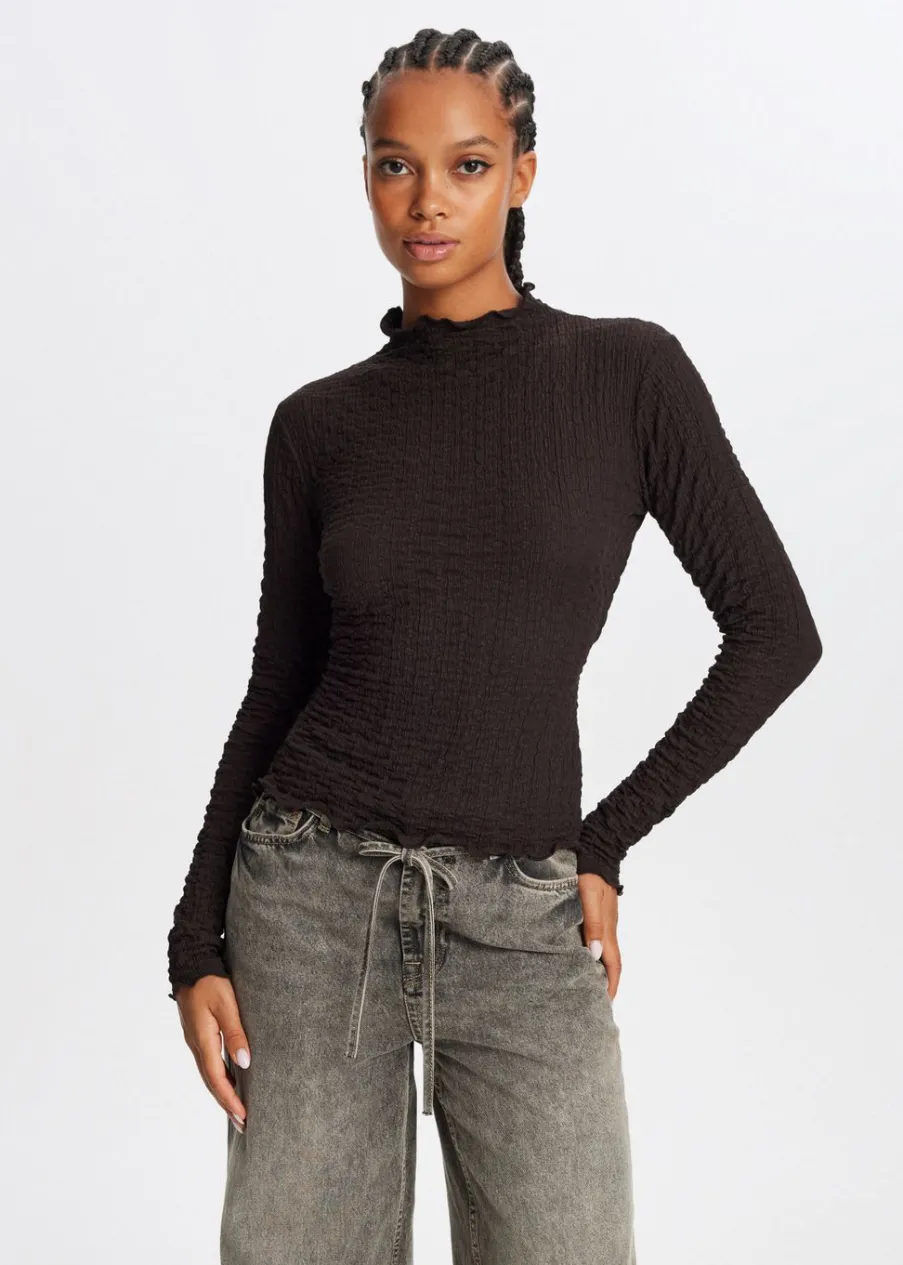 The Sting Top met strikdetail<DAMES Tops