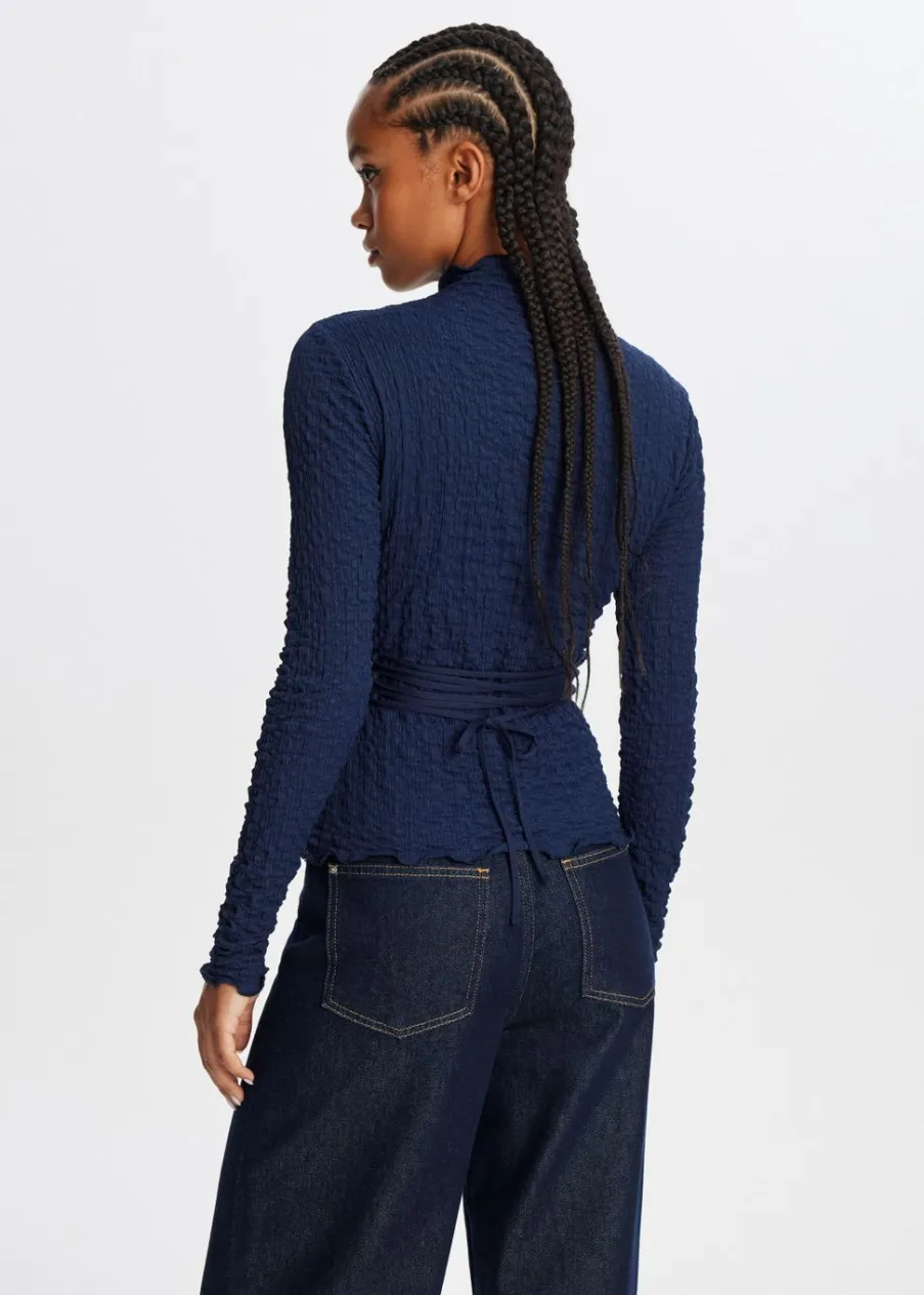 The Sting Top met strikdetail<DAMES Tops